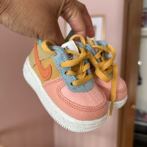 Nike Kids Sneakers in Pink, Orange, Yellow, and Blue
